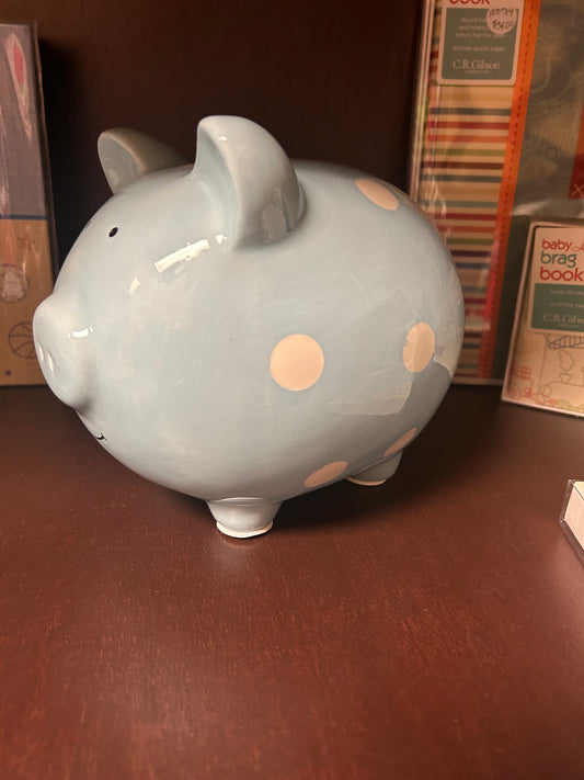 Boy’s blue piggy bank